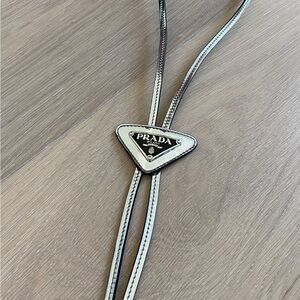 New condition shiny silver leather PRADA BOLO TIE
